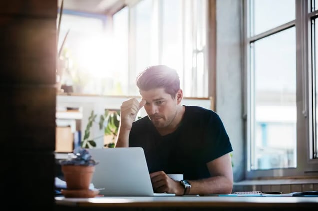 man in office thinking